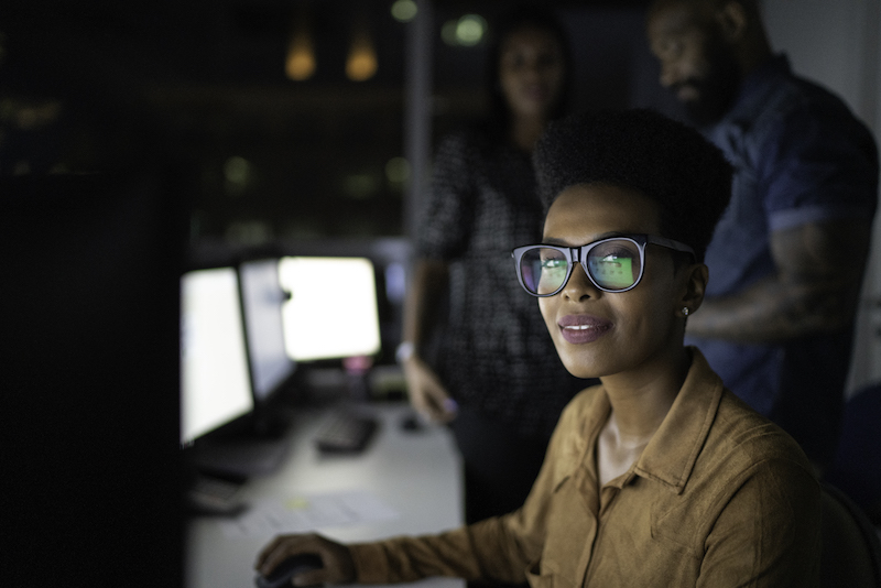 Portrait businesswoman working late in the office Cybersecurity student in front of monitor at desk